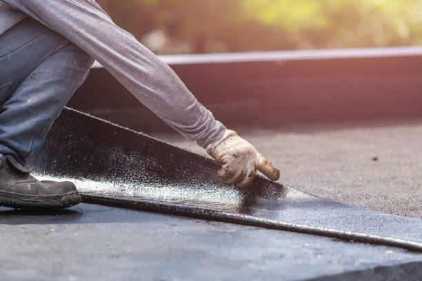 Professional Basement Waterproofing technician working in Arlington, VA